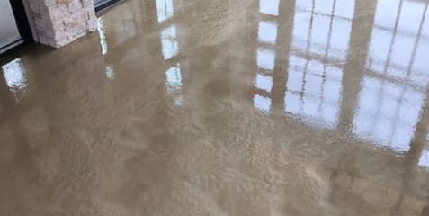 Concrete floor with epoxy coating.