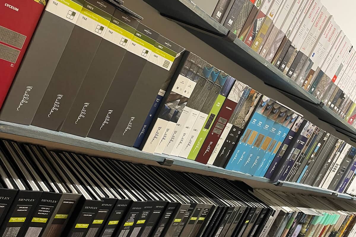 Angled view of shelves of material swatches.