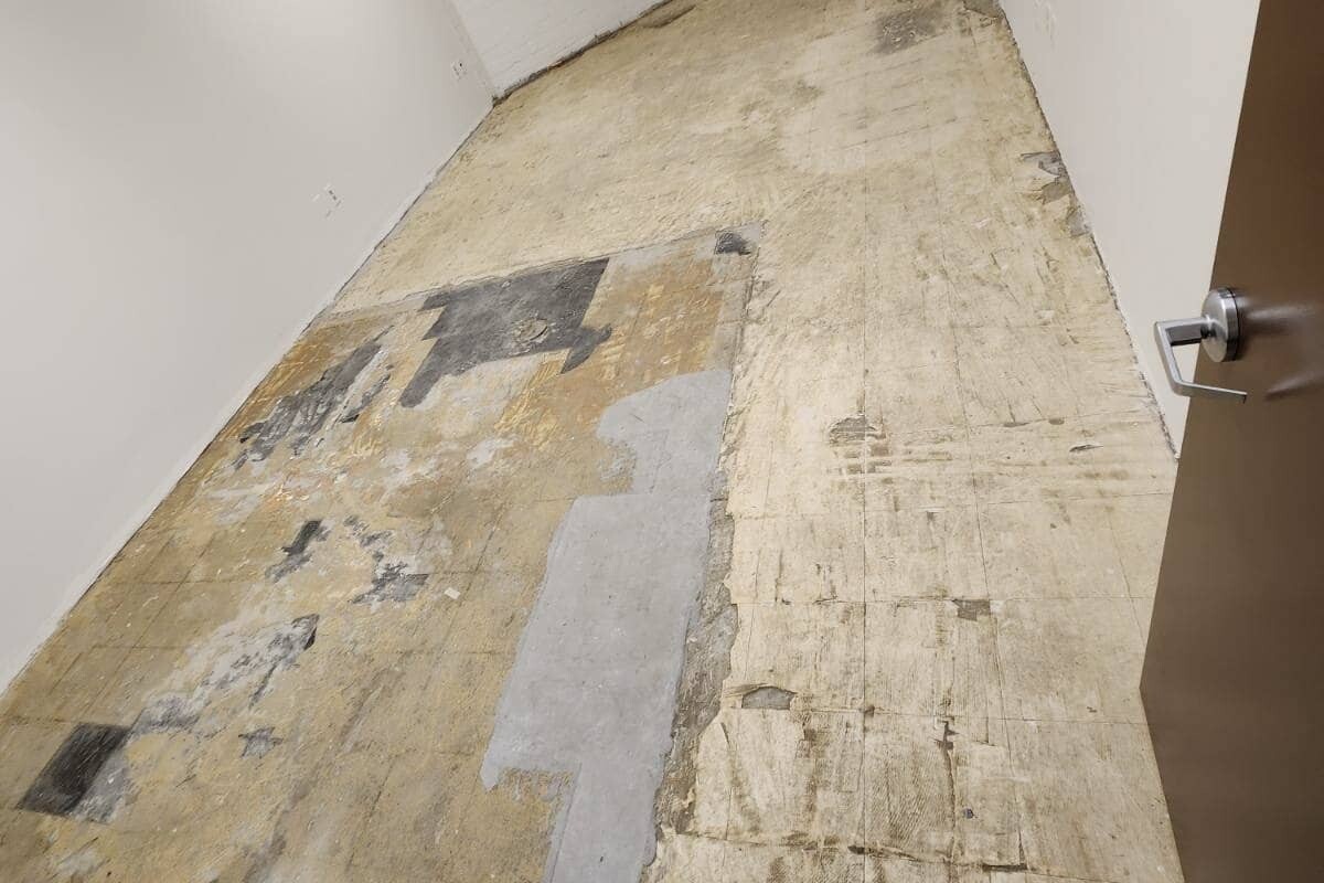 Empty room with dirty, old subfloor.