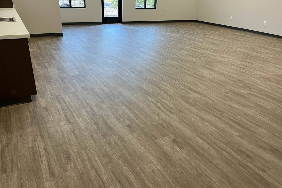 Wood patterned vinyl flooring in an empty commercial building.