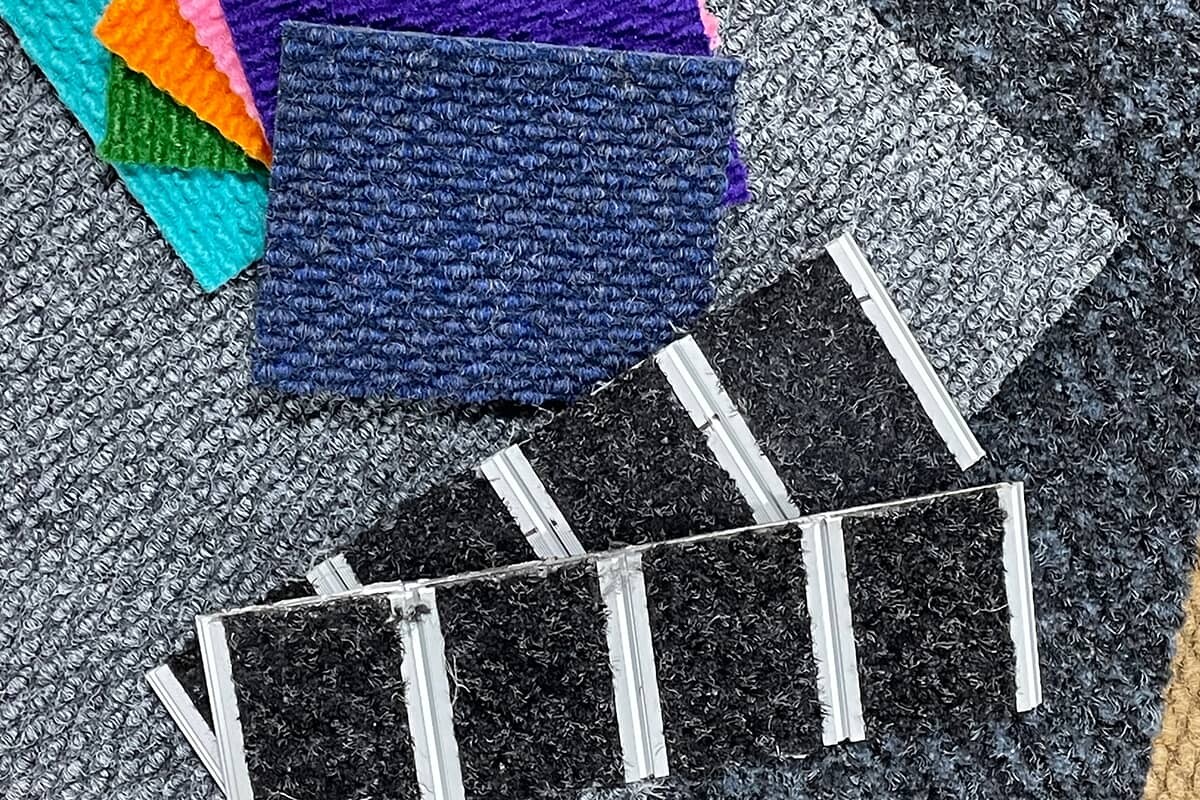 Material swatches for walk off entrance mats in different colors.